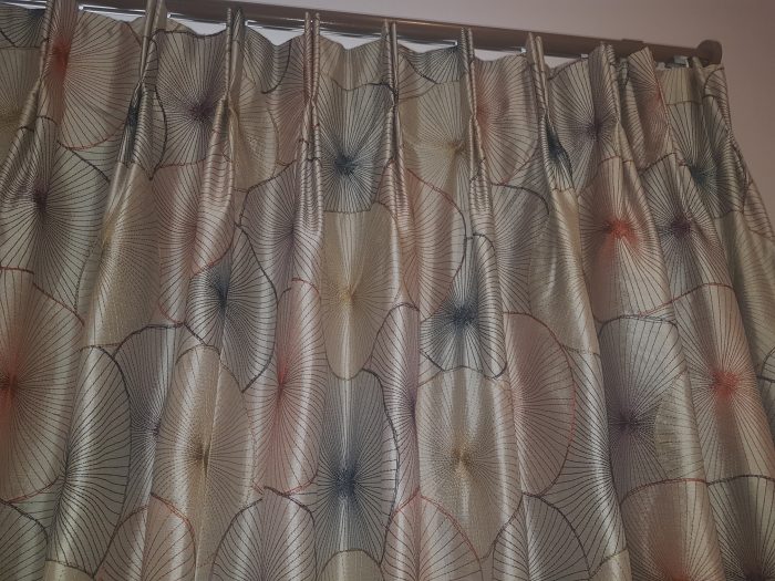 Double pleat curtains hung to corded gliderpole